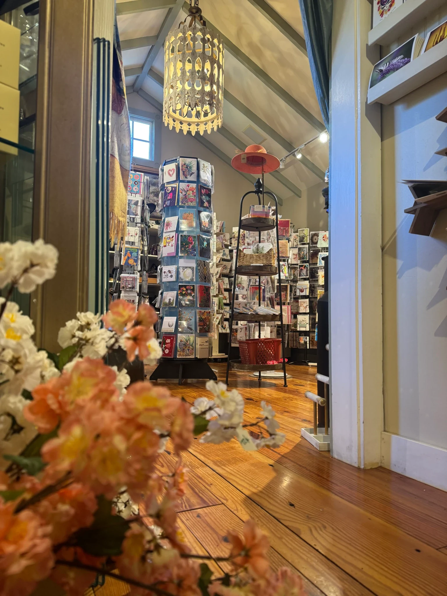 Greeting cards, flowers, and gift displays inside the shop